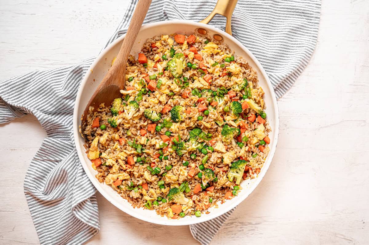 Egg fried rice in a ceramic skillet.