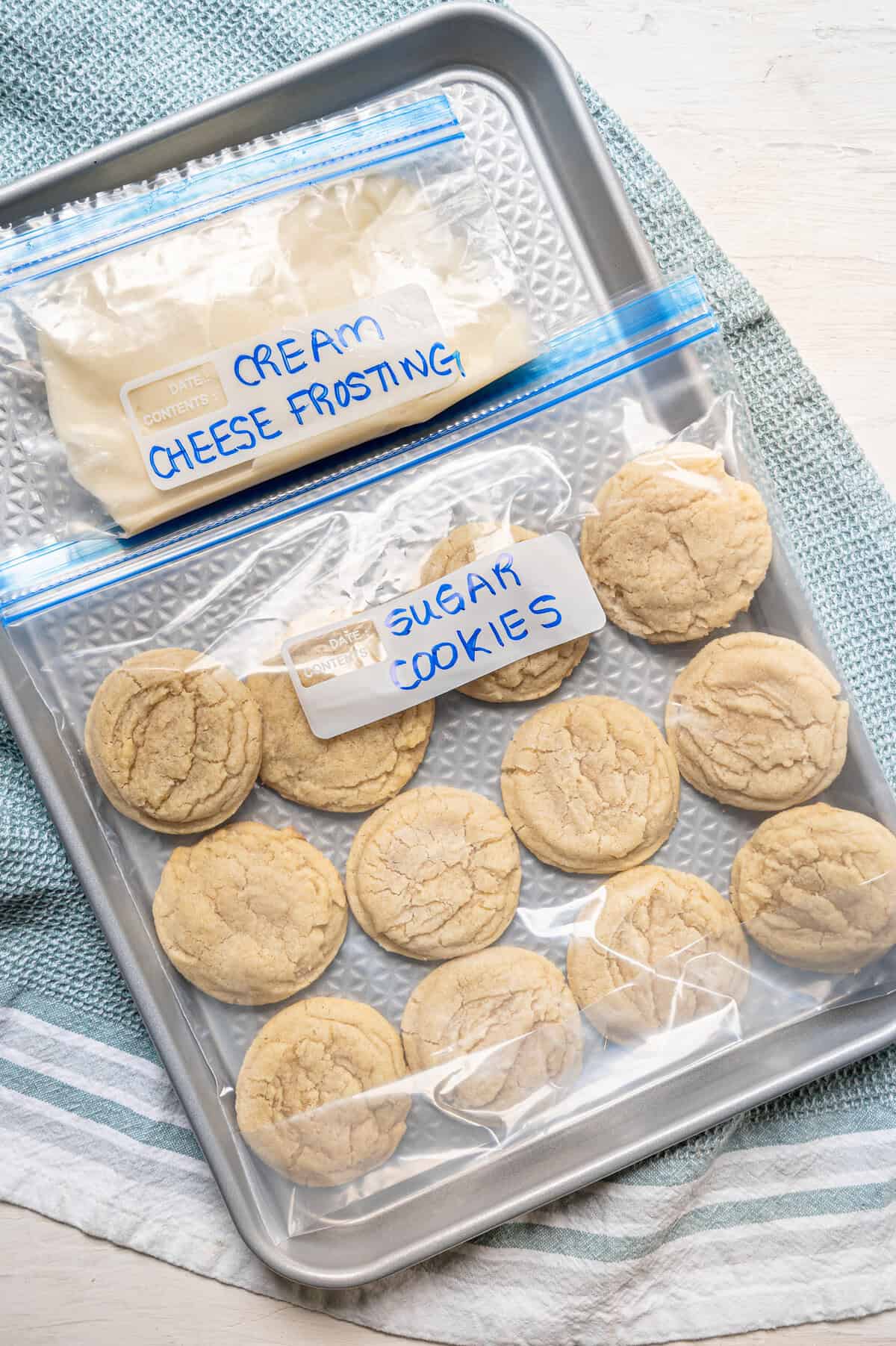 Sugar cookies in a freezer bag and a bag of cream cheese icing in a separate freezer bag.