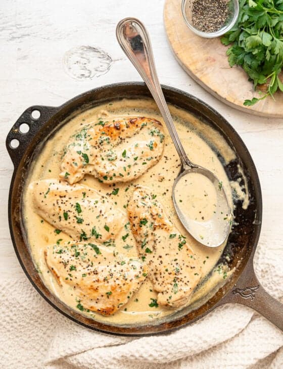 Boursin chicken ready to serve from a cast iron skillet.