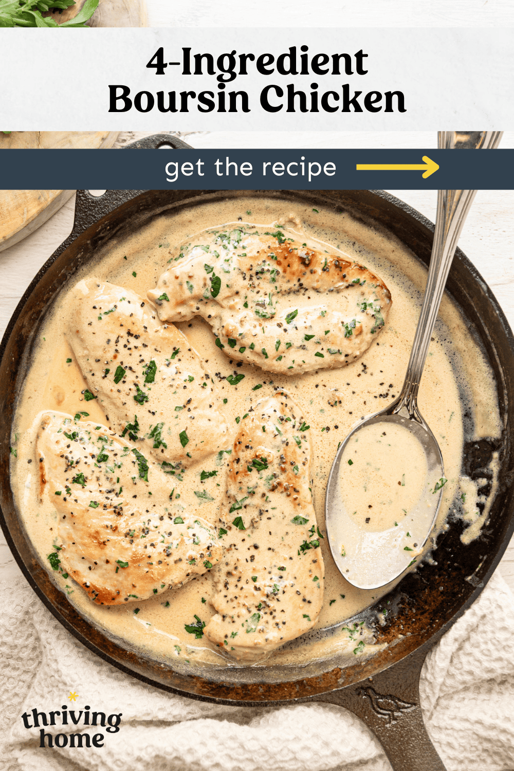 Chicken breasts in a cast iron skillet smothered in Boursin gravy.