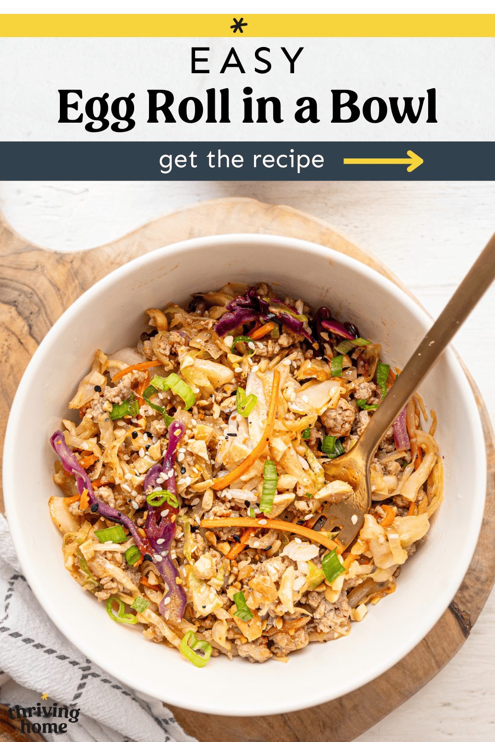Egg roll ingredients served in a bowl with chopped green onion on top.