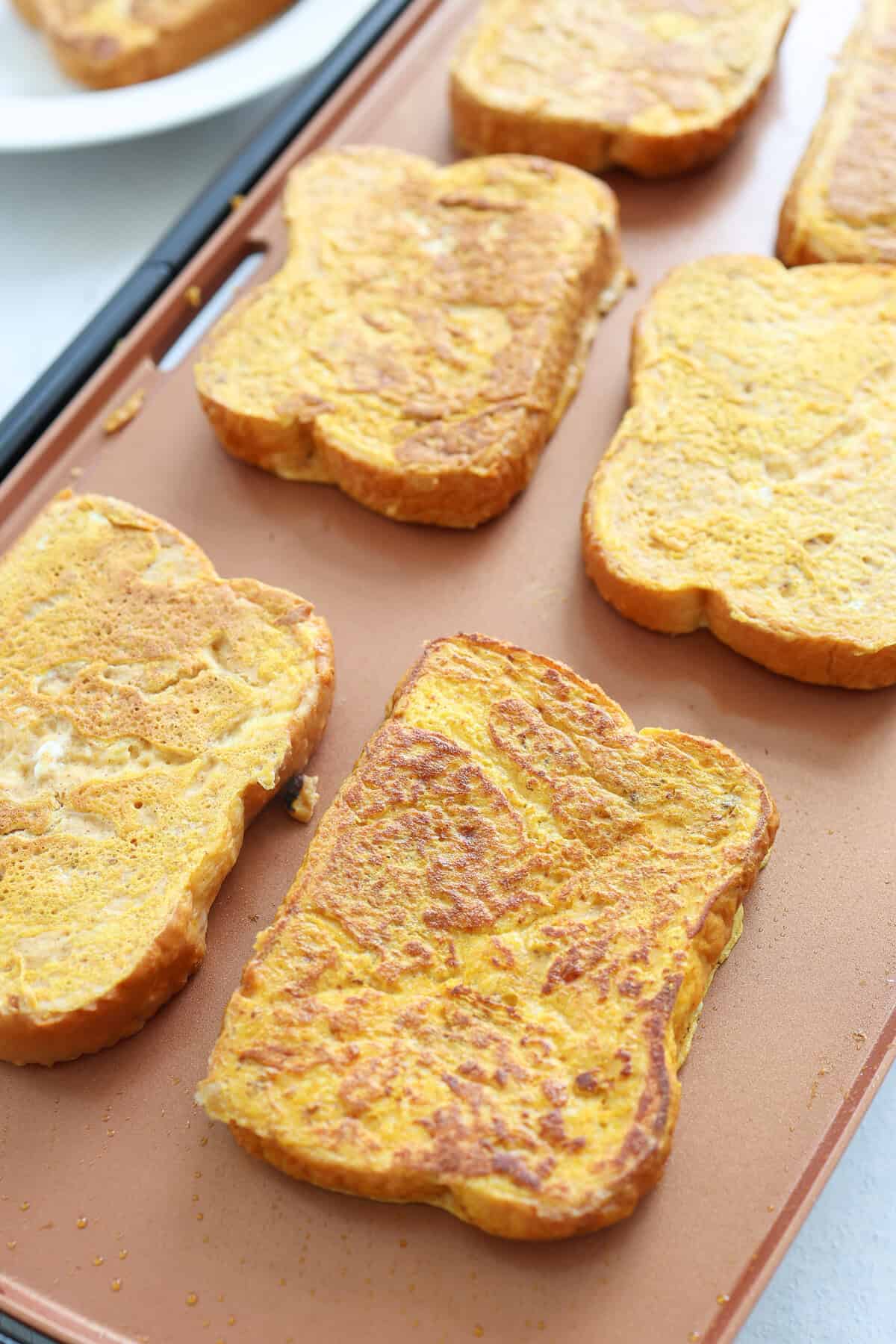 Pumpkin french toast on a baking sheet.