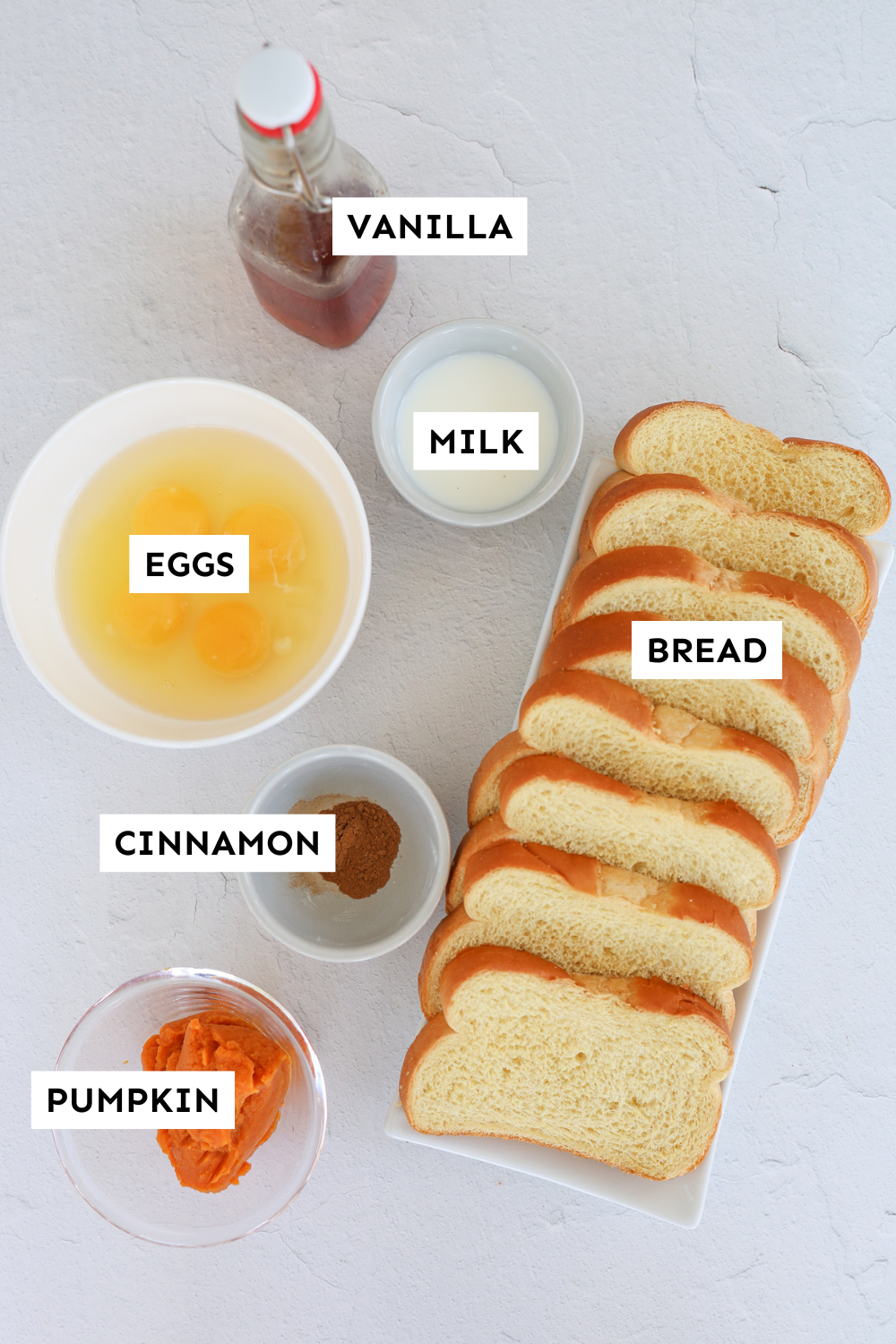 Ingredients for pumpkin french toast measured out and labeled.
