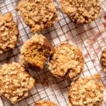 Pumpkin spice muffins on a cooling rack.