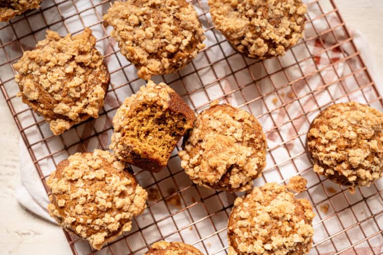 Pumpkin spice muffins on a cooling rack.