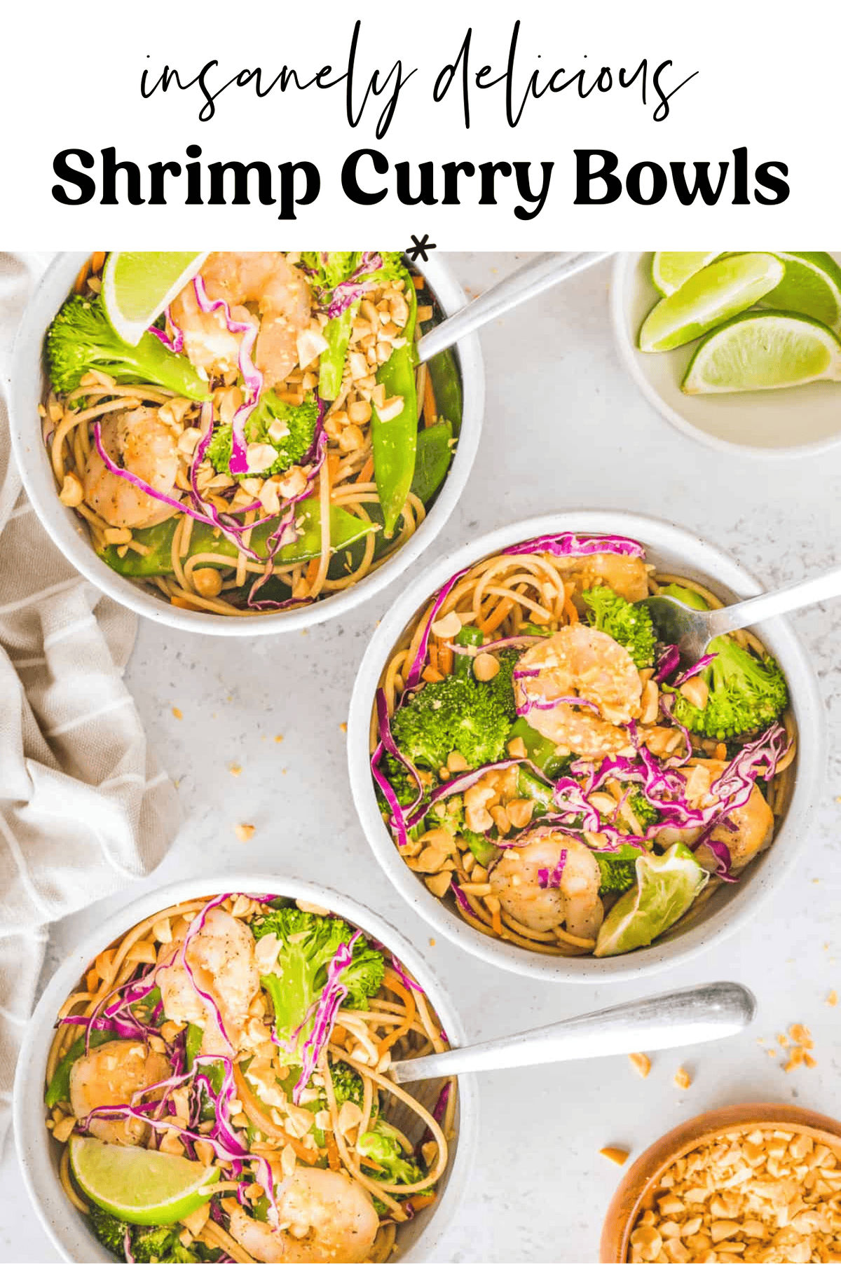 Three bowls of shrimp curry with lime wedges on the side.