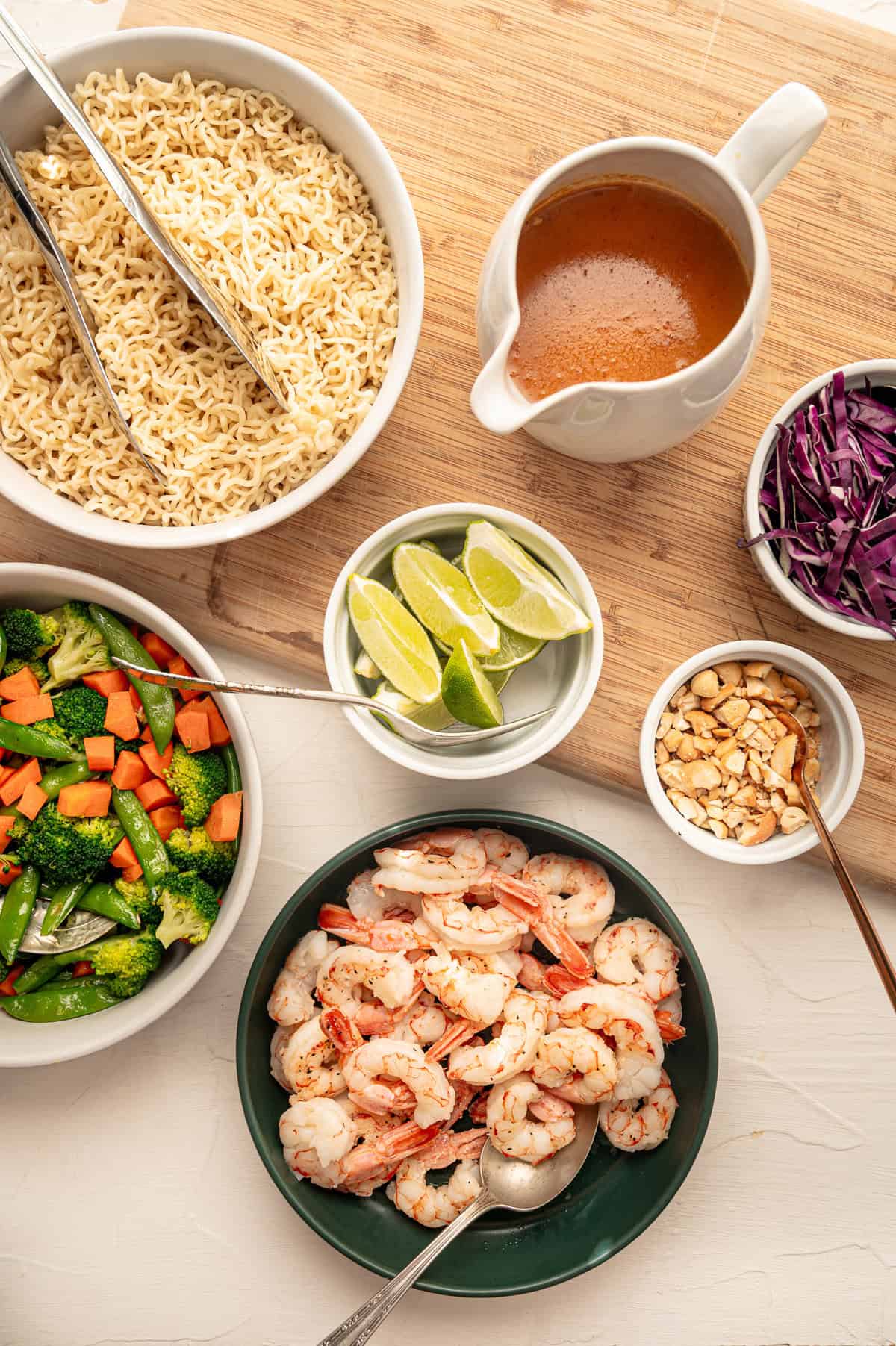 Ingredients for shrimp curry bowls served in various dishes for individuals to make their own.
