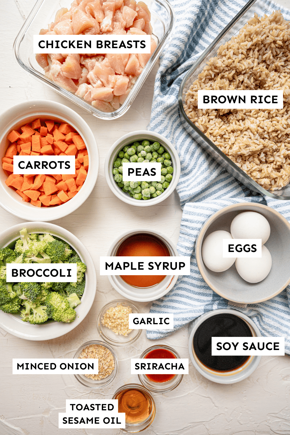 Ingredients for chicken fried rice measured out and labeled.