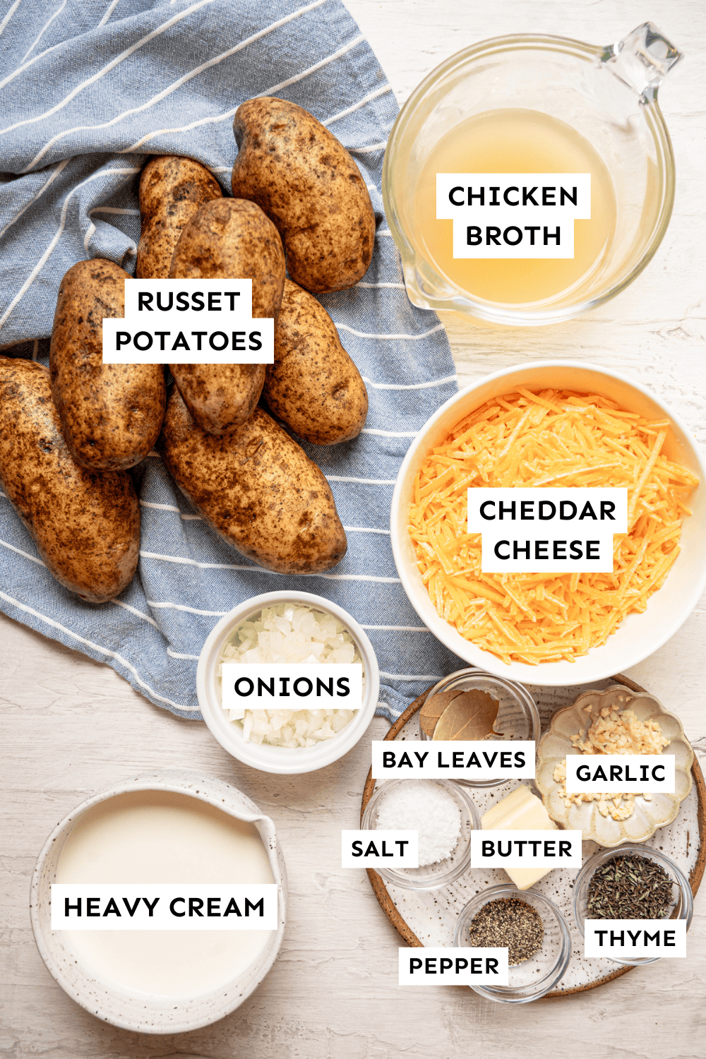 Ingredients for gluten-free scalloped potatoes measured out and labeled.