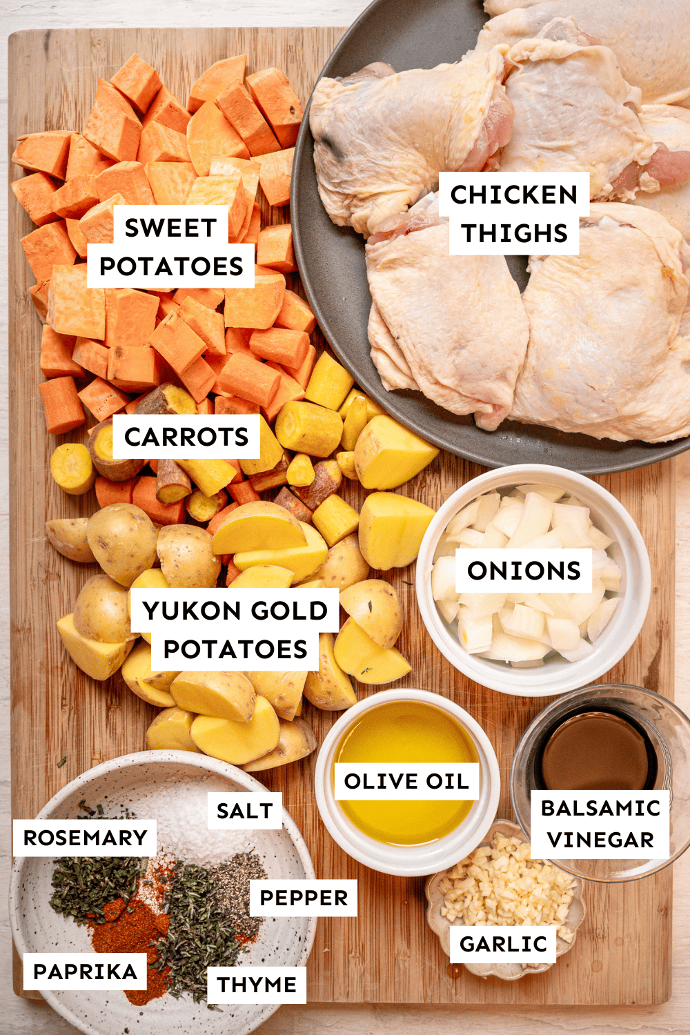 Ingredients for sheet pan chicken and veggies measured out and labeled.