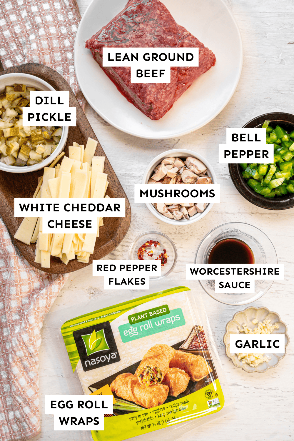 Ingredients for cheeseburger egg rolls measured out and labeled.