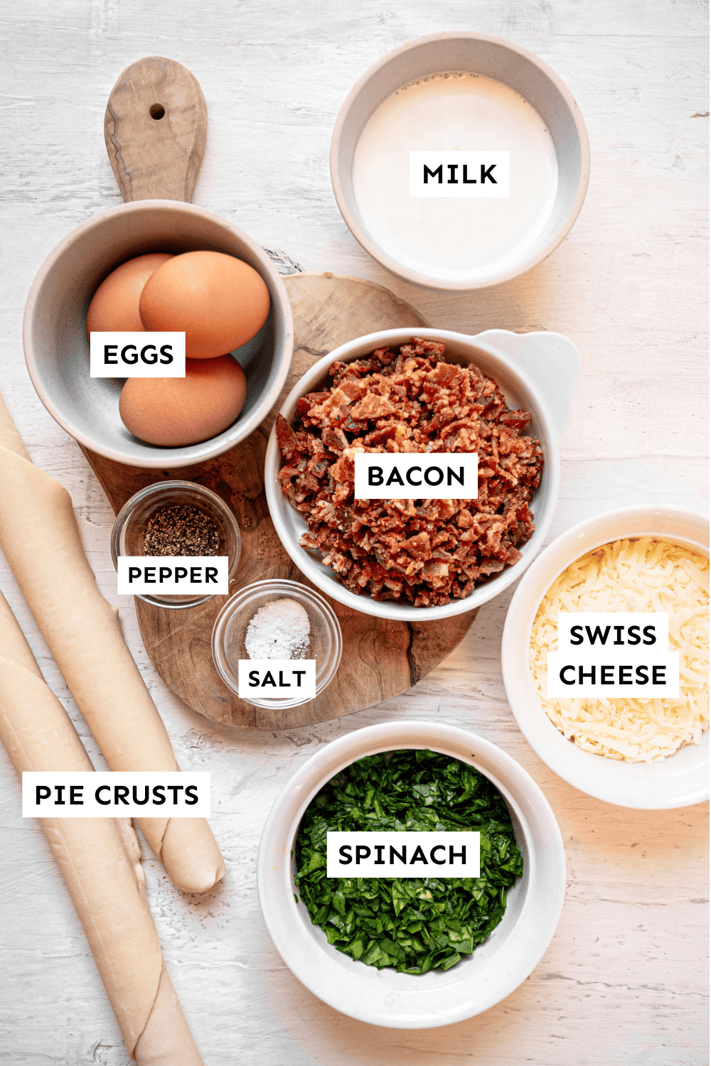Ingredients for spinach and bacon mini quiche measured out and labeled.