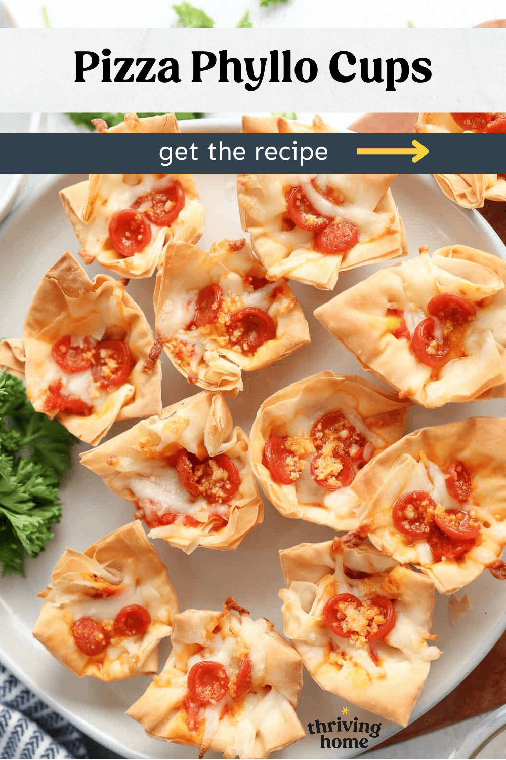 Mini phyllo cups with mozzarella and mini pepperoni on a platter.