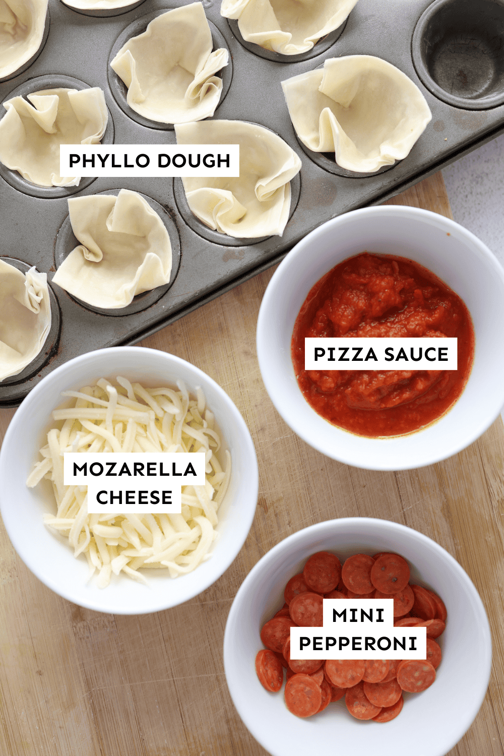 Ingredients for mini pizza phyllo cups measured out and labeled.