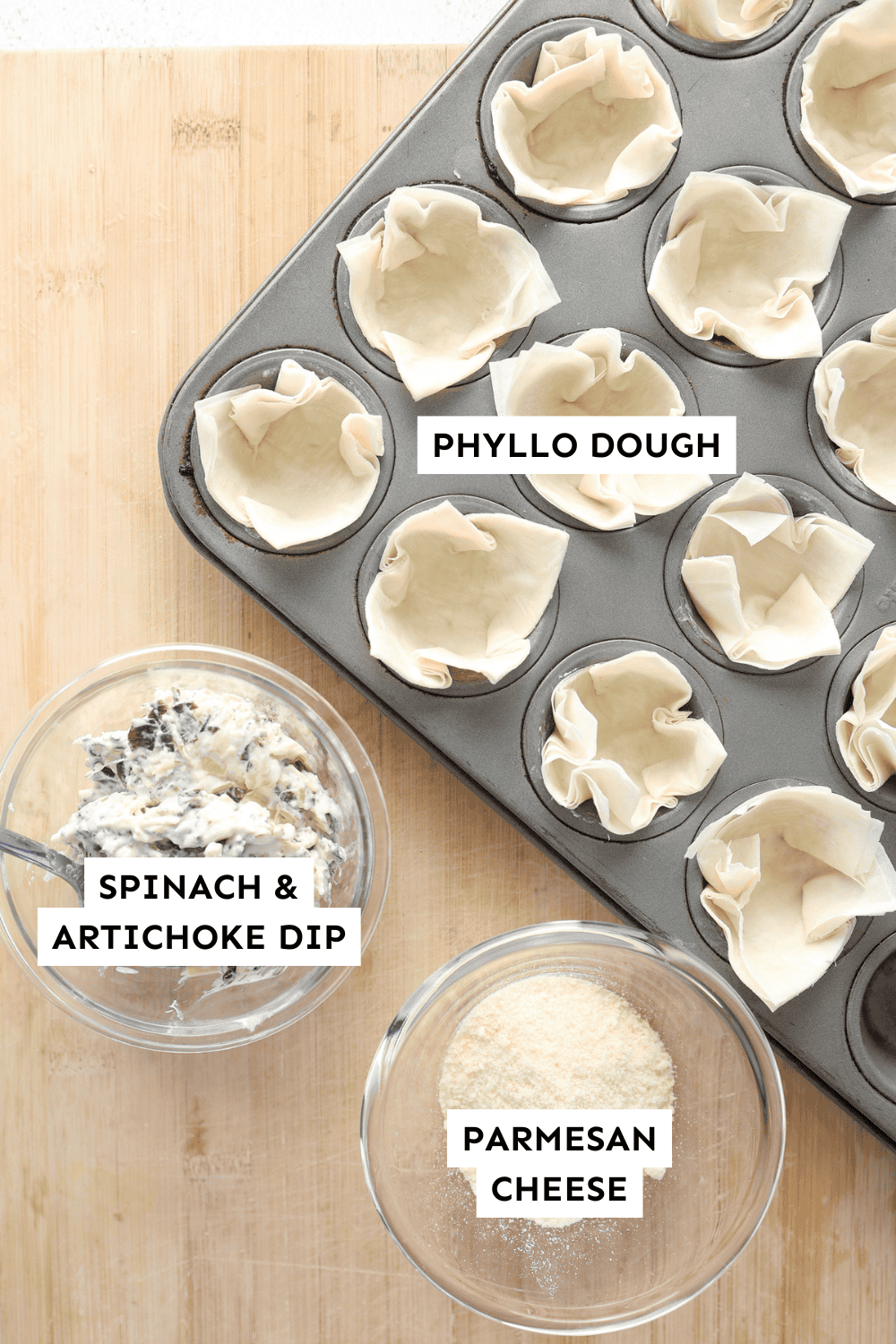 Ingredients for spinach artichoke mini phyllo cups measured out and labeled.