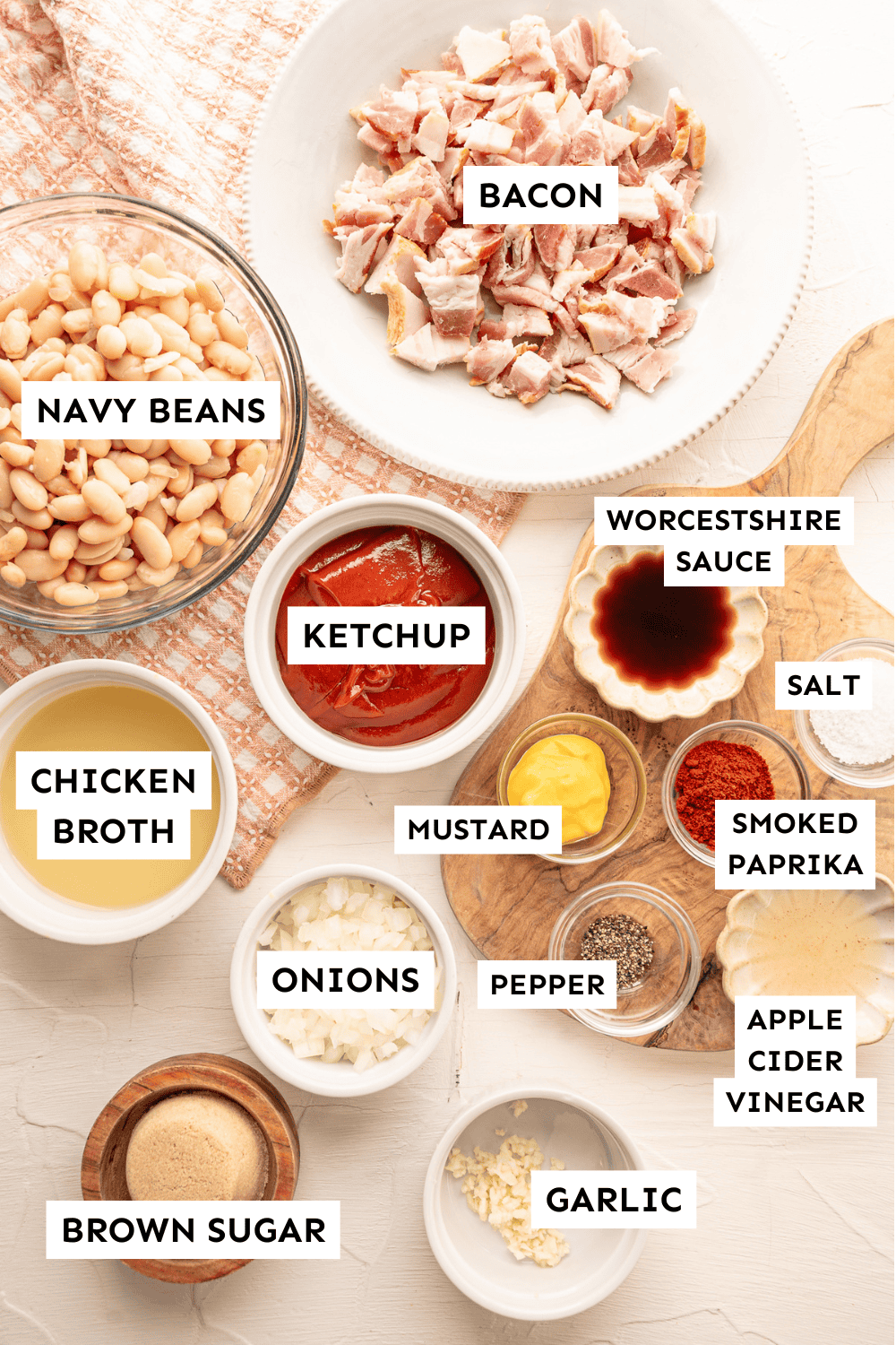 Ingredients for baked beans measured out and labeled.