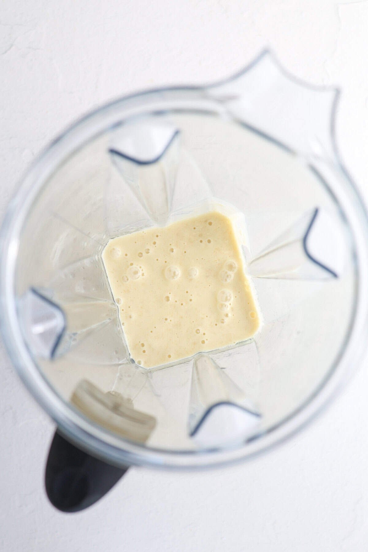 Wet ingredients for blueberry banana bread in a blender.