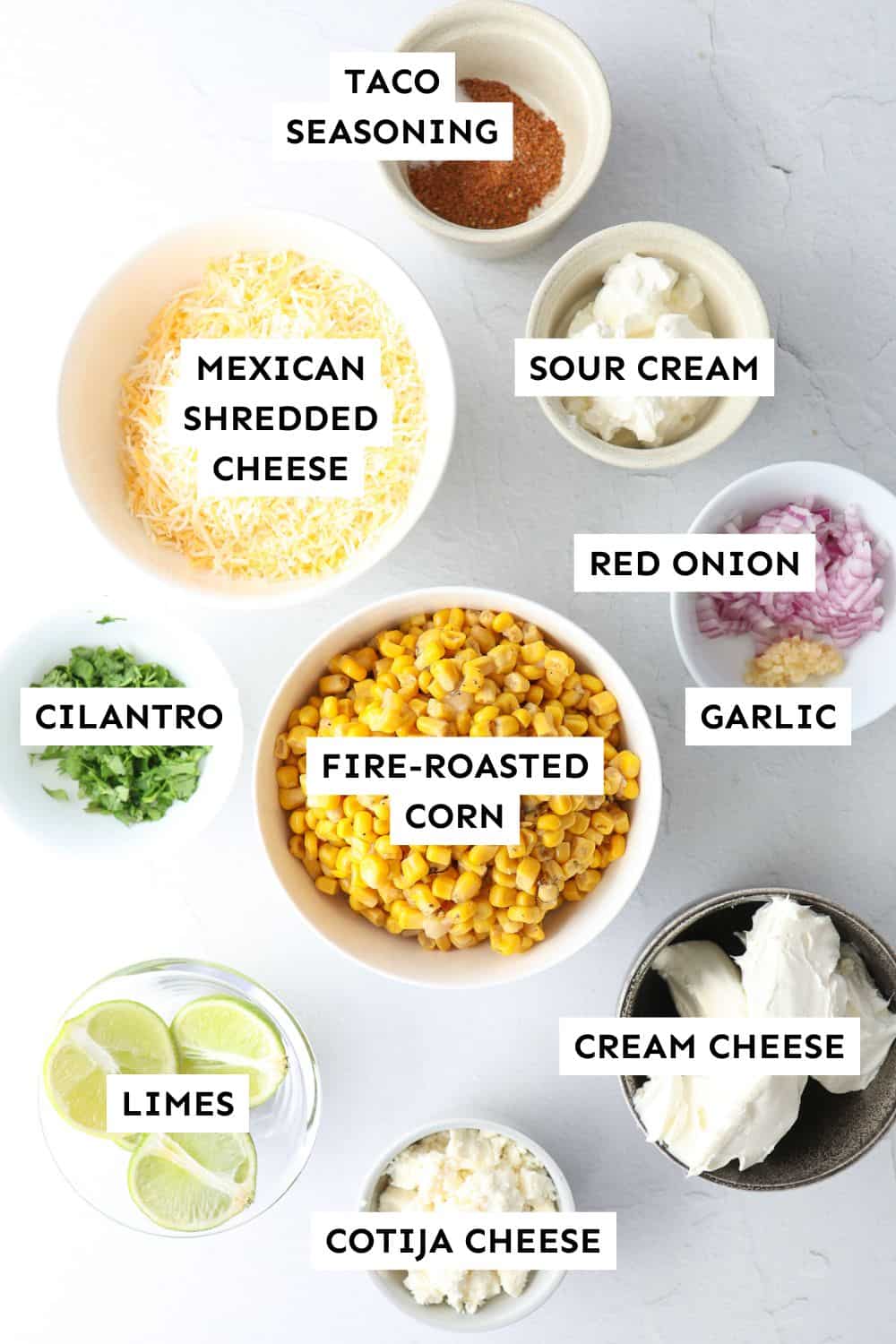 Mexican street corn dip ingredients measured out and labeled.