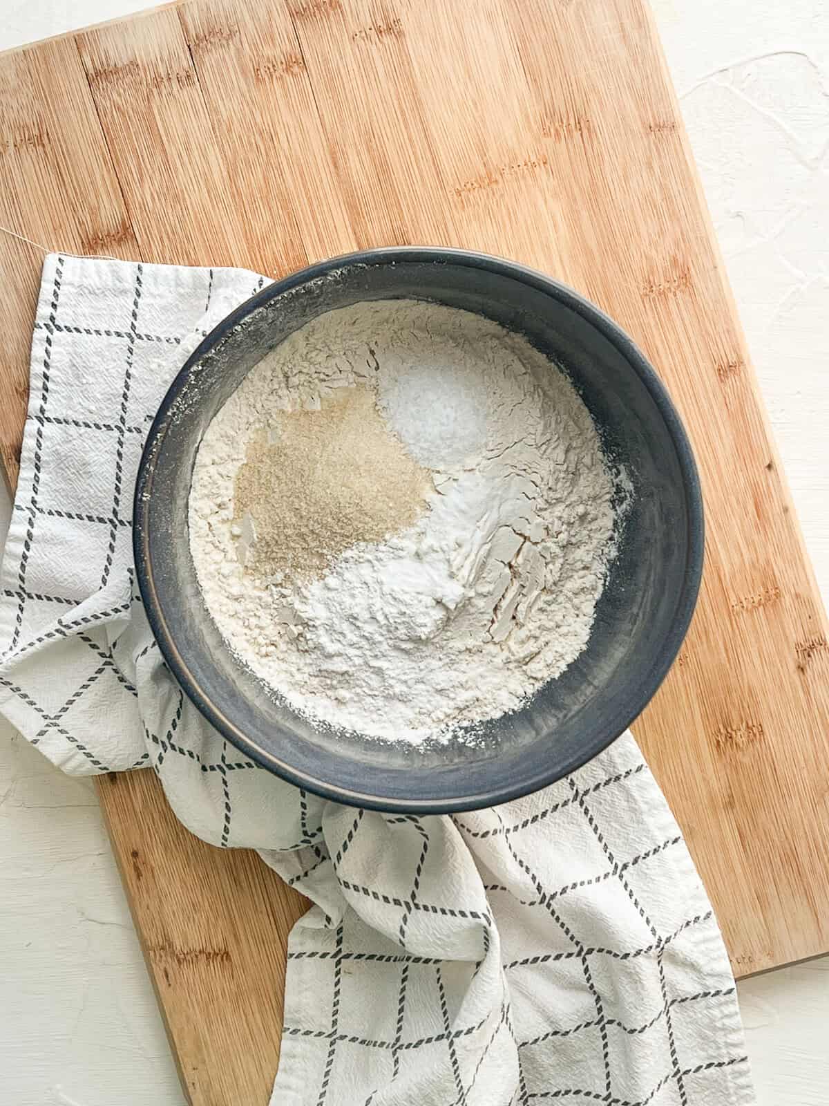 Dry ingredients in a gray ceramic mixing bowl.