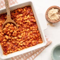 A casserole dish of baked beans ready to serve.