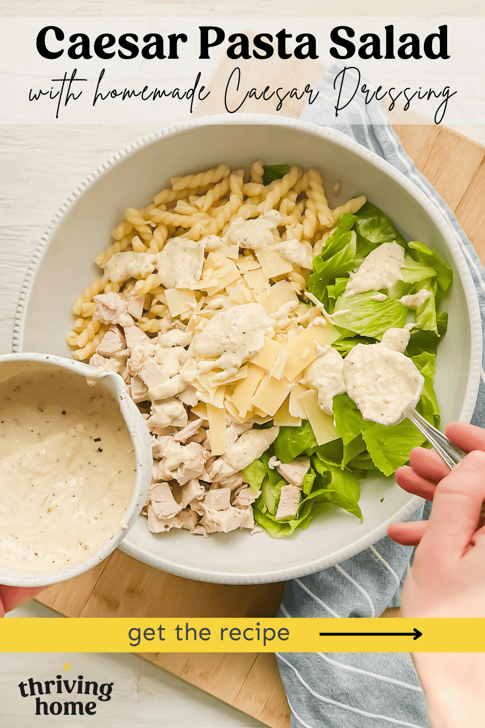 Ingredients for Caesar pasta salad in a bowl being dressed with homemade Caesar dressing.