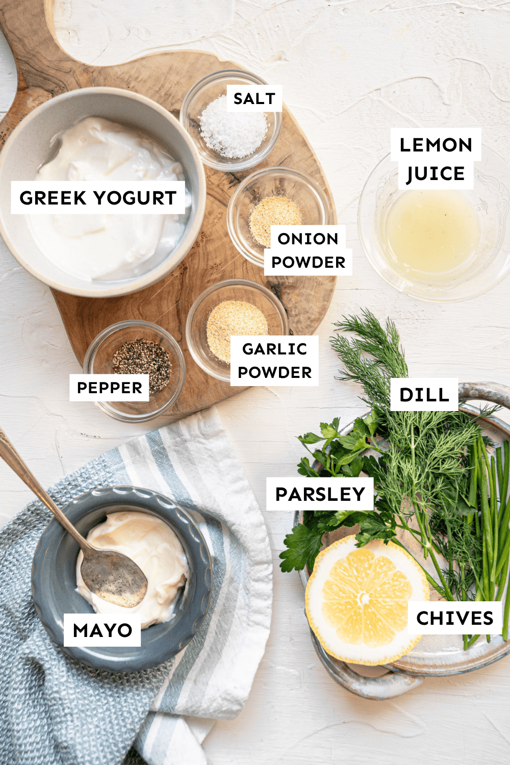 Ingredients for homemade ranch dressing measured out and labeled.