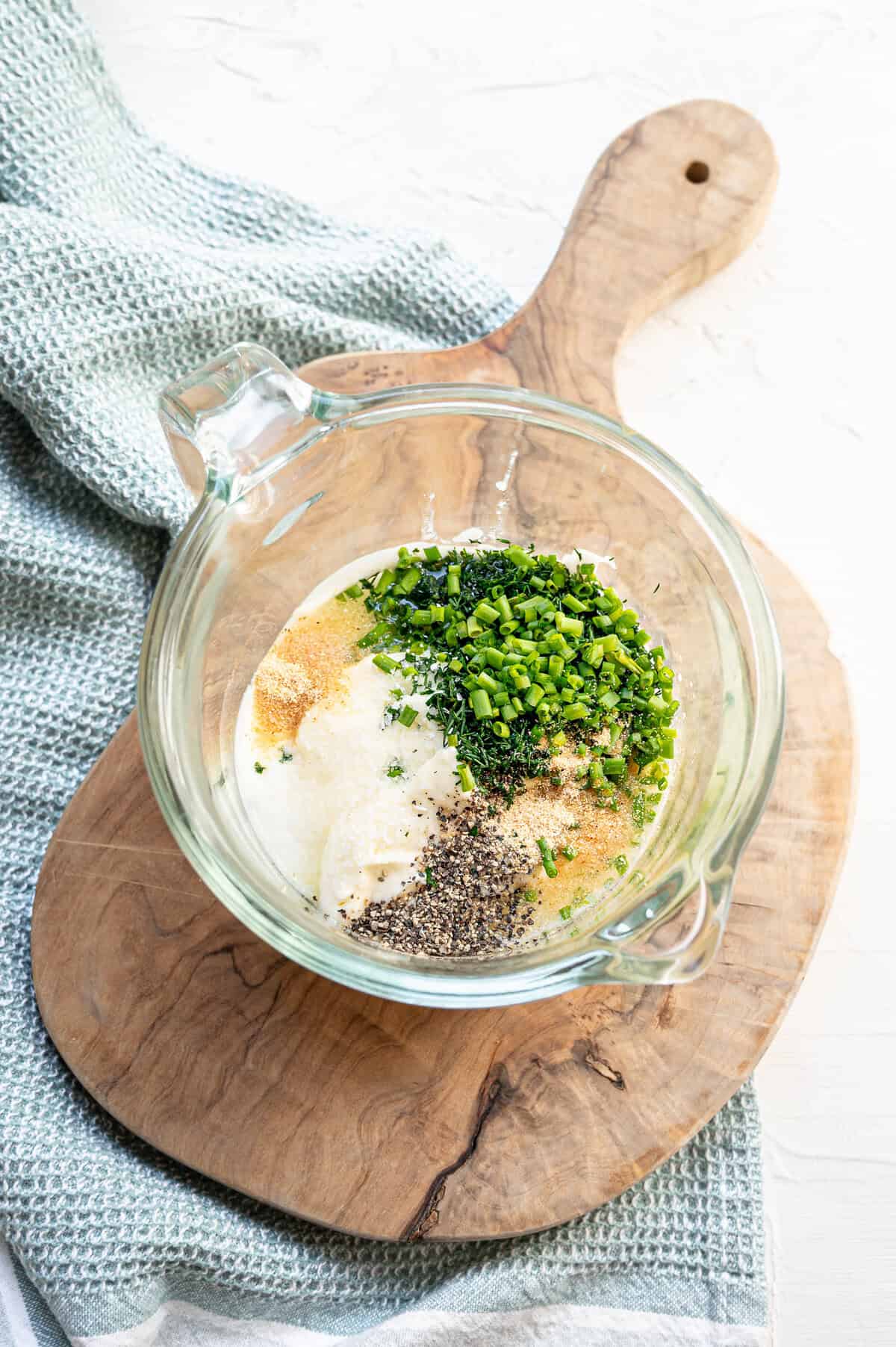 Ingredients for homemade ranch dressing ready to be mixed together.
