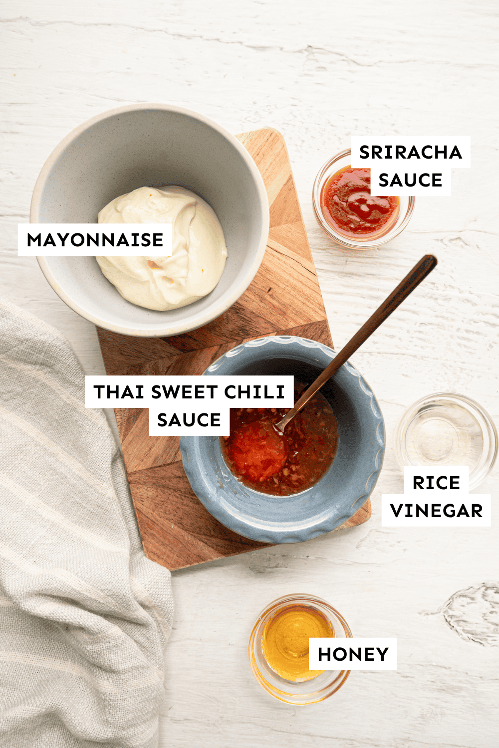 Ingredients for Bang Bang Sauce measured out and labeled.