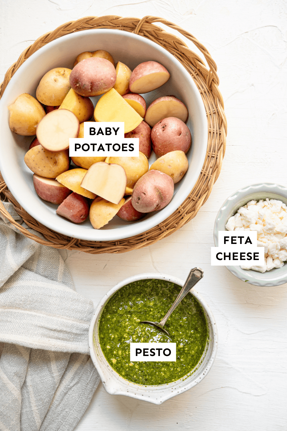 Ingredients for pesto potato salad measured out and labeled.
