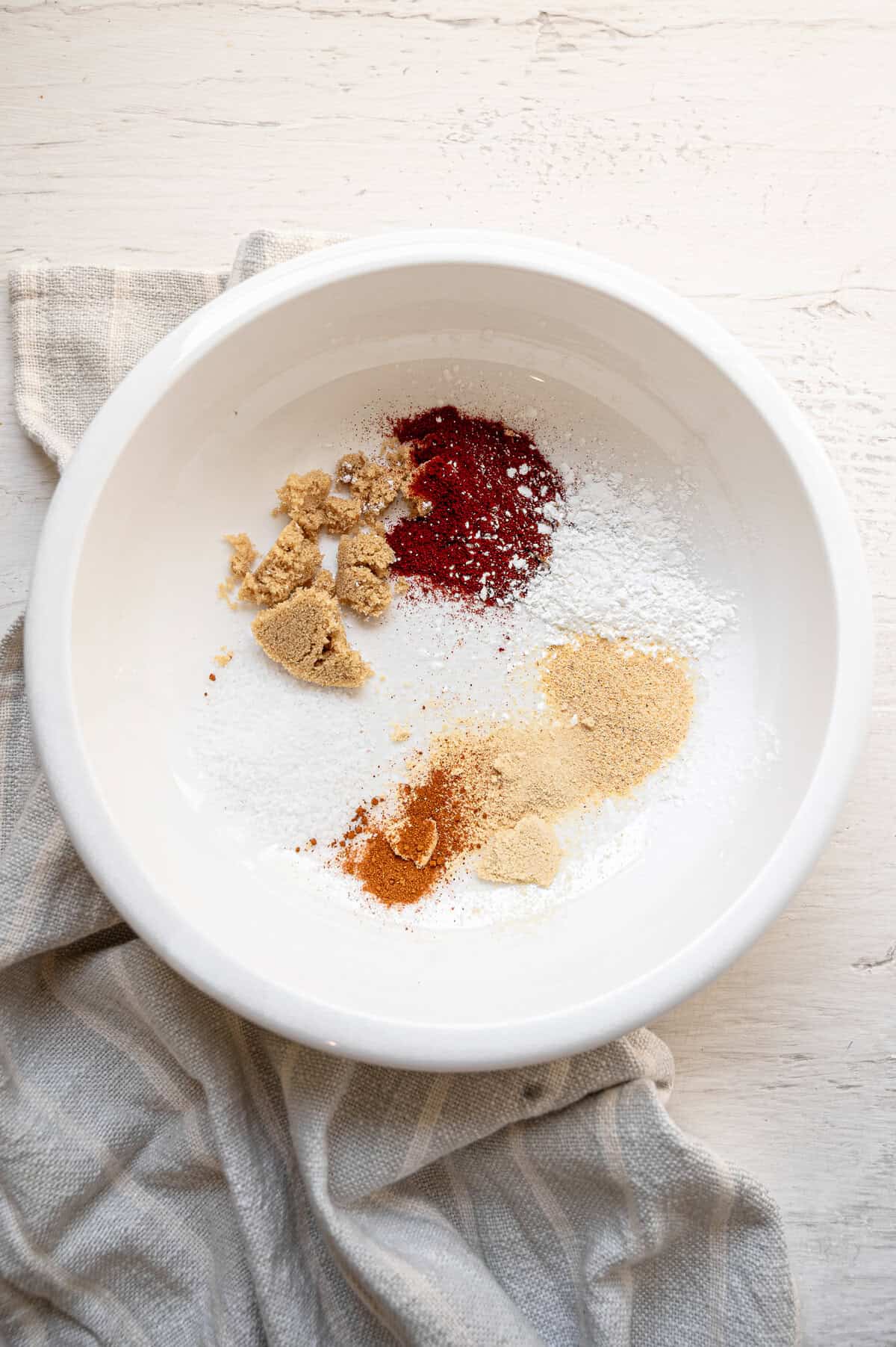 Seasonings in a bowl for air fryer salmon bites.