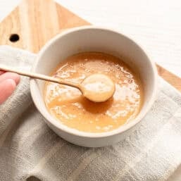 Bang Bang Sauce being spooned out of a small bowl.