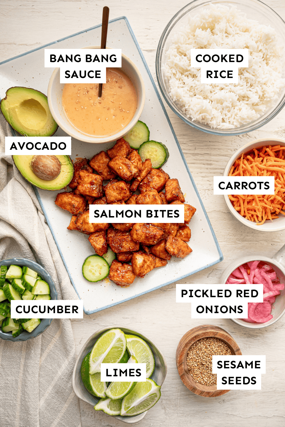 Ingredients for Bang Bang Salmon Bowls laid out in separate bowls and labeled.