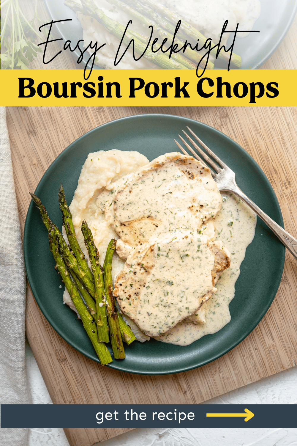 Boursin pork chops on a plate with asparagus.