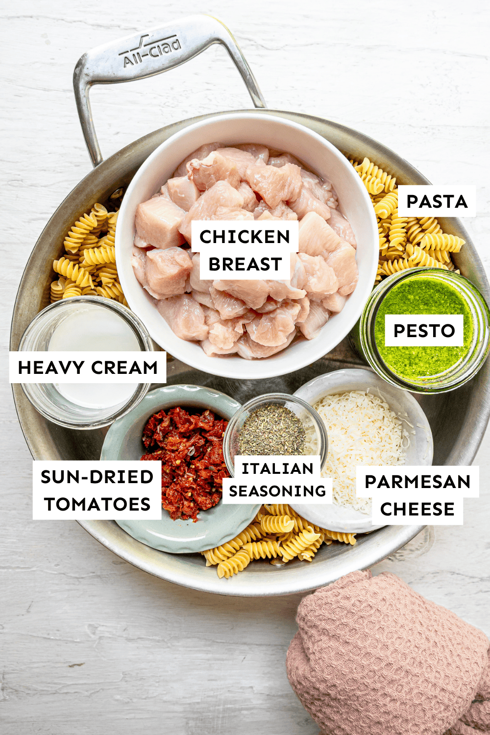 Creamy chicken pesto pasta ingredients measured out and labeled.